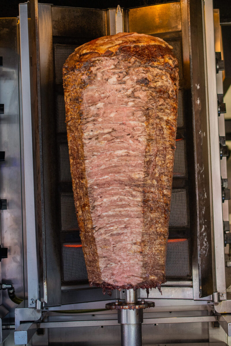 Traditional Turkish food Doner Kebab. Turnspit skewing kebap  kebab shawarma